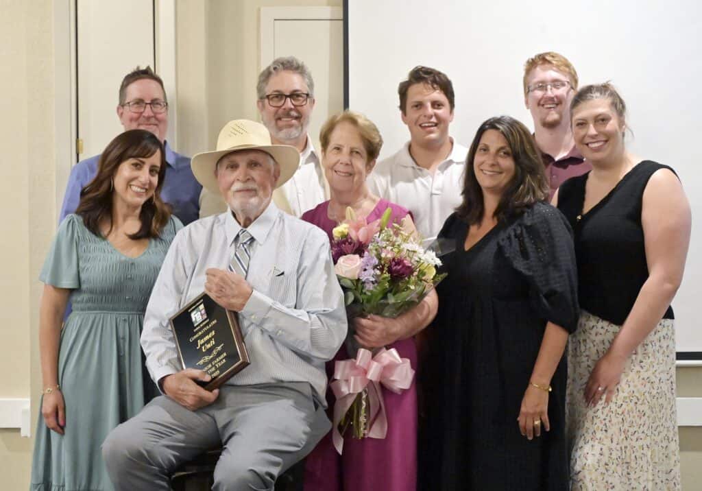 Photo - 2025 Senior Farmer of the Year Jim Unti, is joined by his wife Tina and their family during a celebration hosted by the Madera Chamber of Commerce on Thursday at the Madera Municipal Golf Course.
