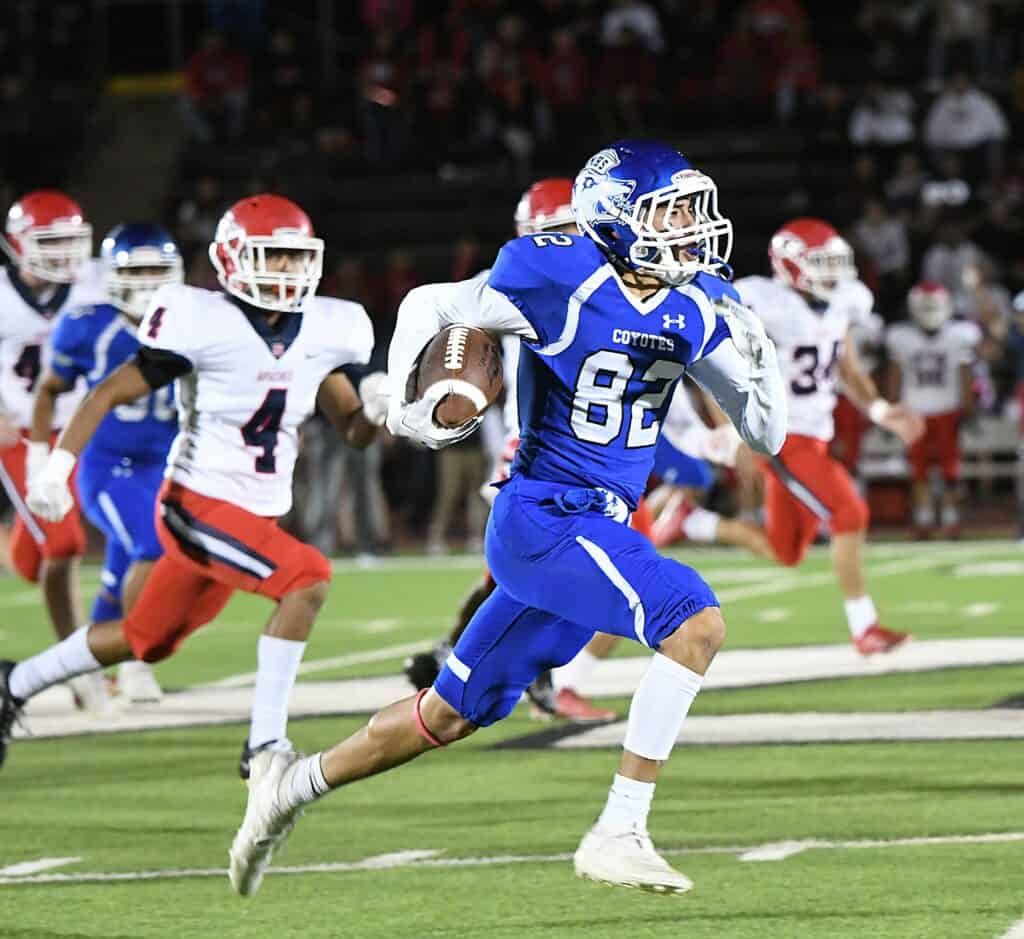 Photo - Madera’s Jonathan Ramirez returns a kickoff 60 yards in the first quarter to set up a Madera touchdown.