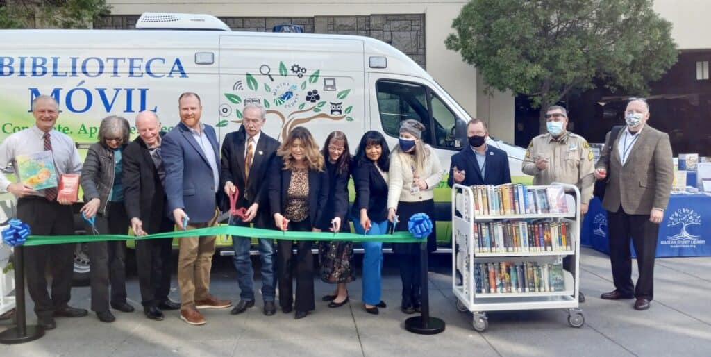 Photo - The Madera County Board of Supervisors cut the ribbon for the Madera County Library’s new mobile library last week.