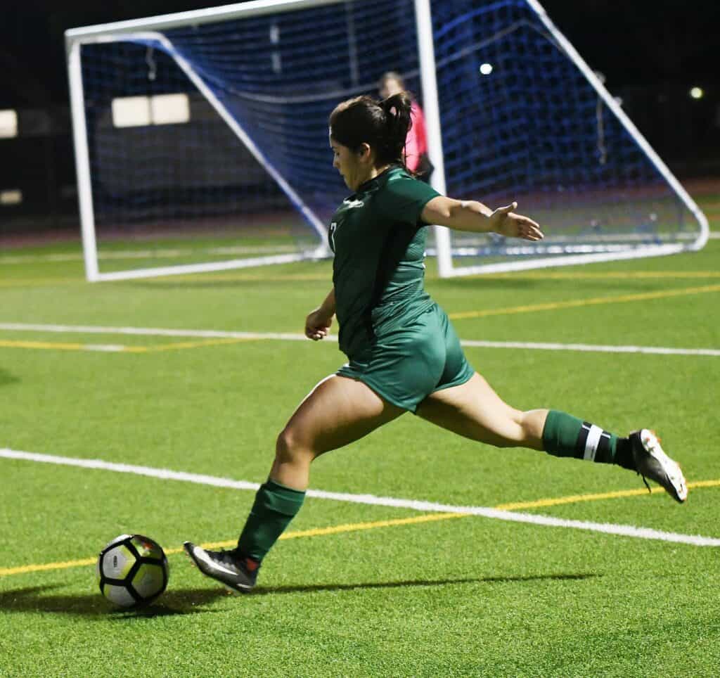 Photo - Liberty’s Angelica Ponce sends a free kick up the field. She scored the only goal in Wednesday’s victory over the Madera Coyotes in Memorial Stadium.