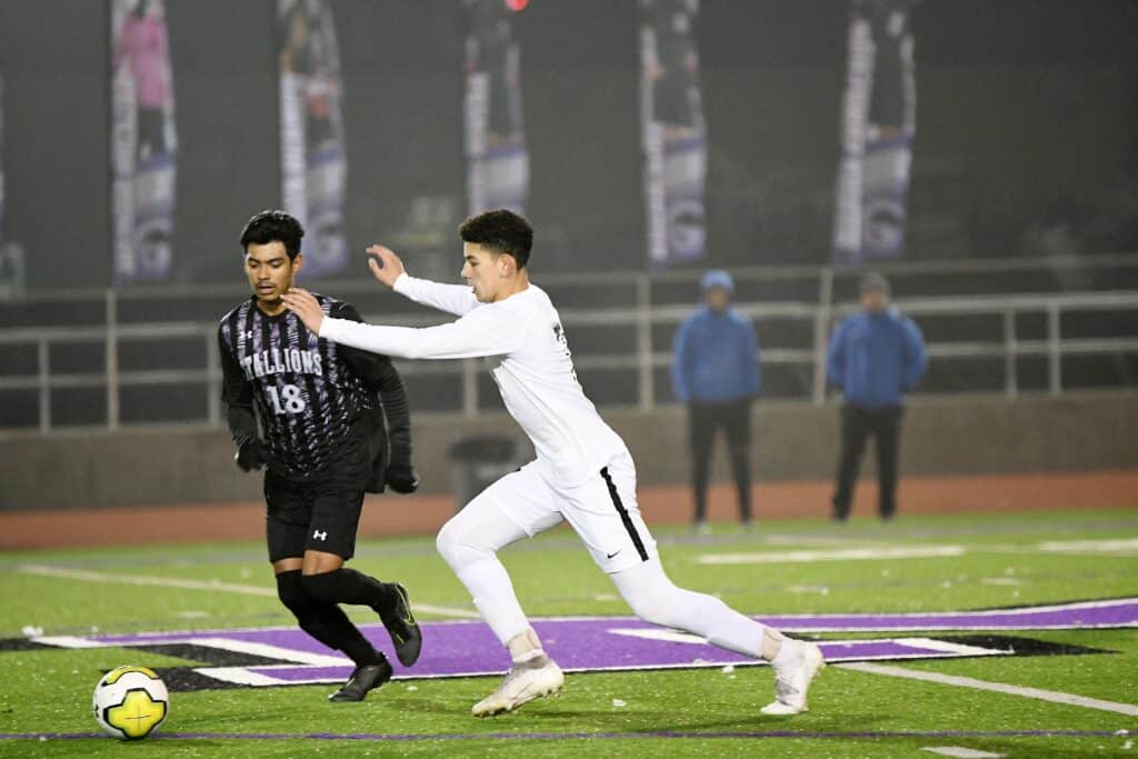 Photo - Madera South’s Arturo Zavala controls the ball in the middle of the field against Madera on Tuesday. Zavala scored both goals in a 2-0 victory.