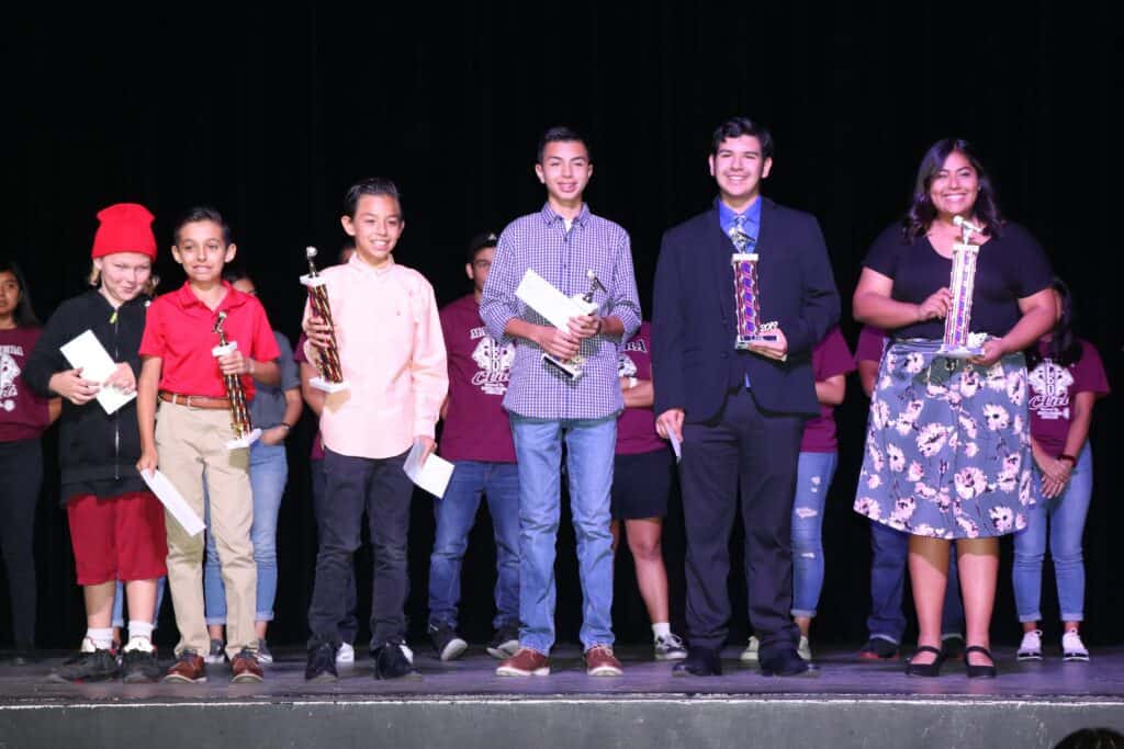 Photo - “Madera’s Got Talent” winners from left, Nova Krumm, Vincent Rodriguez, Isaac Beltran, German Guiterrez, Fabian Beltran, and Rachel Diaz gather on stage after receiving their awards at the competition on Saturday.