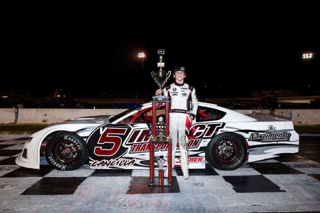 Photo - 12-year-old Vito Cancilla celebrates in victory lane after capturing the Madera SpeedFest on Saturday. Cancilla became the youngest winner in the history of Pro Late Models with the victory.