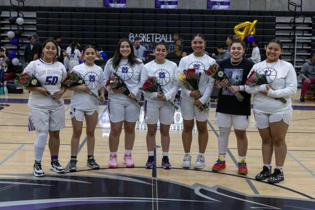 Photo - The Madera South Stallions honors its seniors before Thursday’s game with Matilda Torres. From left are Mia Ruiz, Ariel Rieux, Jessika Ramirez, Saqira Reyes, Mayra Ceballos, Alannah Ward.and Jasmine Marrero.