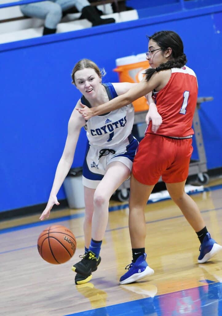 Photo - Madera’s Lilly Smith drives baseline against Firebaugh. She scored 10 points to help led Madera to a 62-9 victory over the Eagles on Friday.