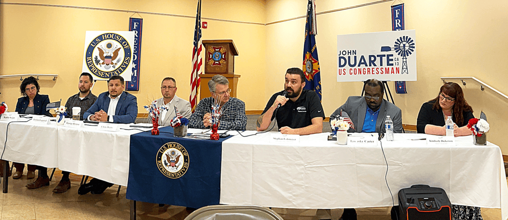 Photo - The Veterans Town Hall panel, held at VFW Post 1981 on August 14, was arranged by Congressman John Duarte and his staff. Speakers from the panel, seated from left, Karla Seijas from UC Merced, Jordan Esquivel of La Familia Central Valley, George Retana of Veterans in Action, Chris Watts of Veterans Advisory Committee, Congressman John Duarte, Stephan Lohmeyer of Modesto Junior College Veteran Services, Tawasky Carter of Veterans Benefits Administration-Oakland Office, and Kimberly Dickerson.