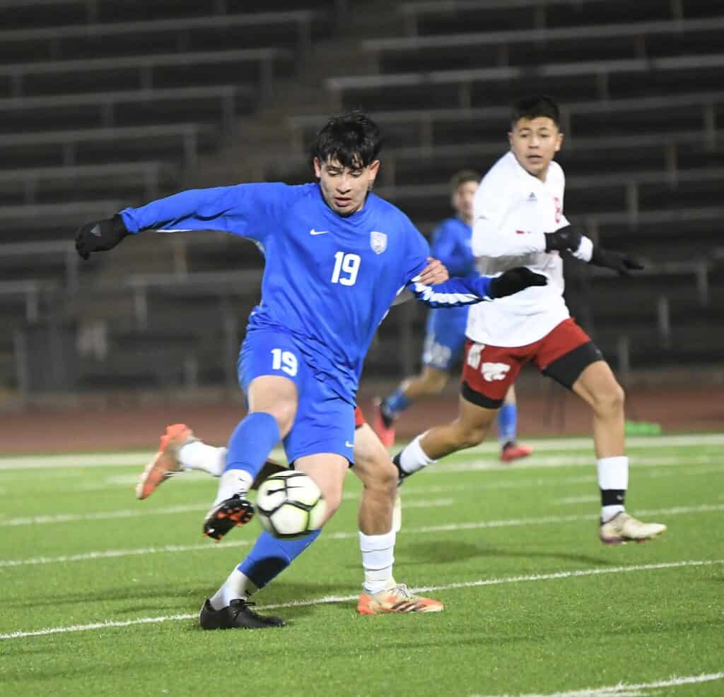 Photo - Madera’s Angel Segovia sends a shot on goal during Tuesday’s 1-0 loss to the Fowler Redcats.