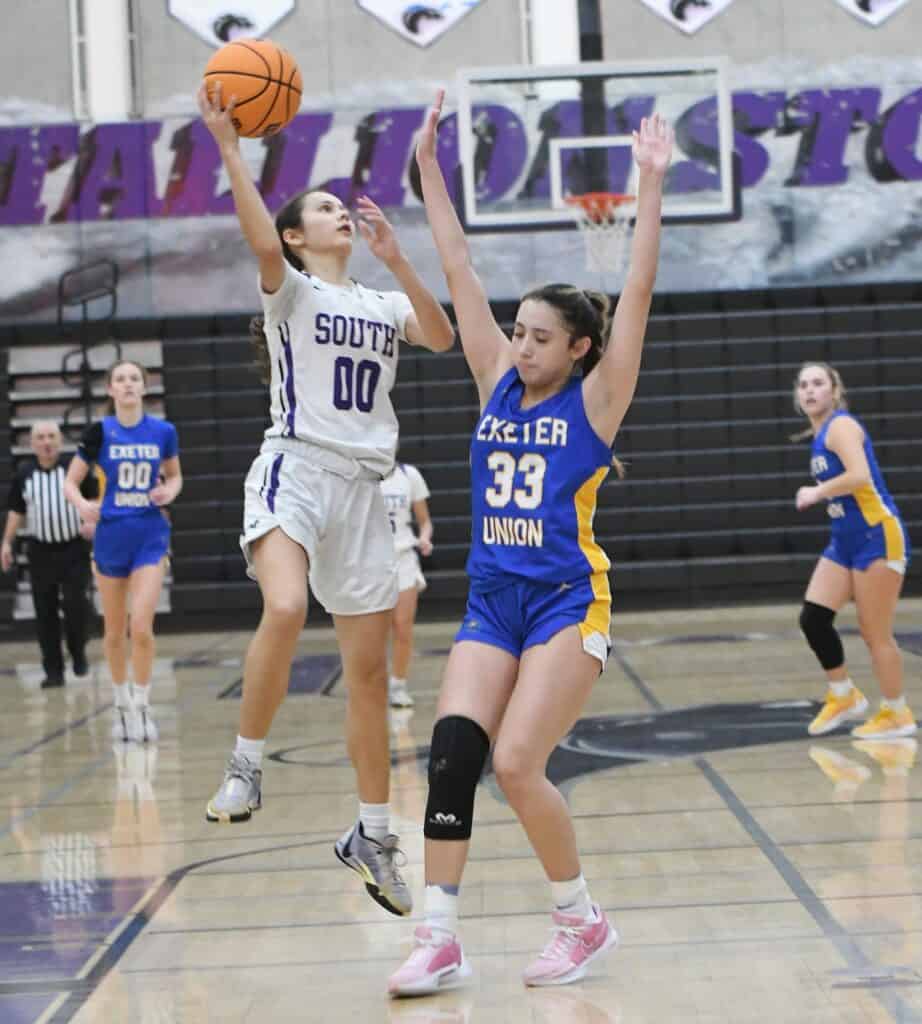 Photo - Madera South’s Briannah Lorta drives to the hoop to score two of her game-high 20 points in overtime during Friday’s 38-32 overtime victory over Exeter. Lorta also hit the 3-pointer at the final buzzer to send the game into overtime in the Div. V quarterfinal game.