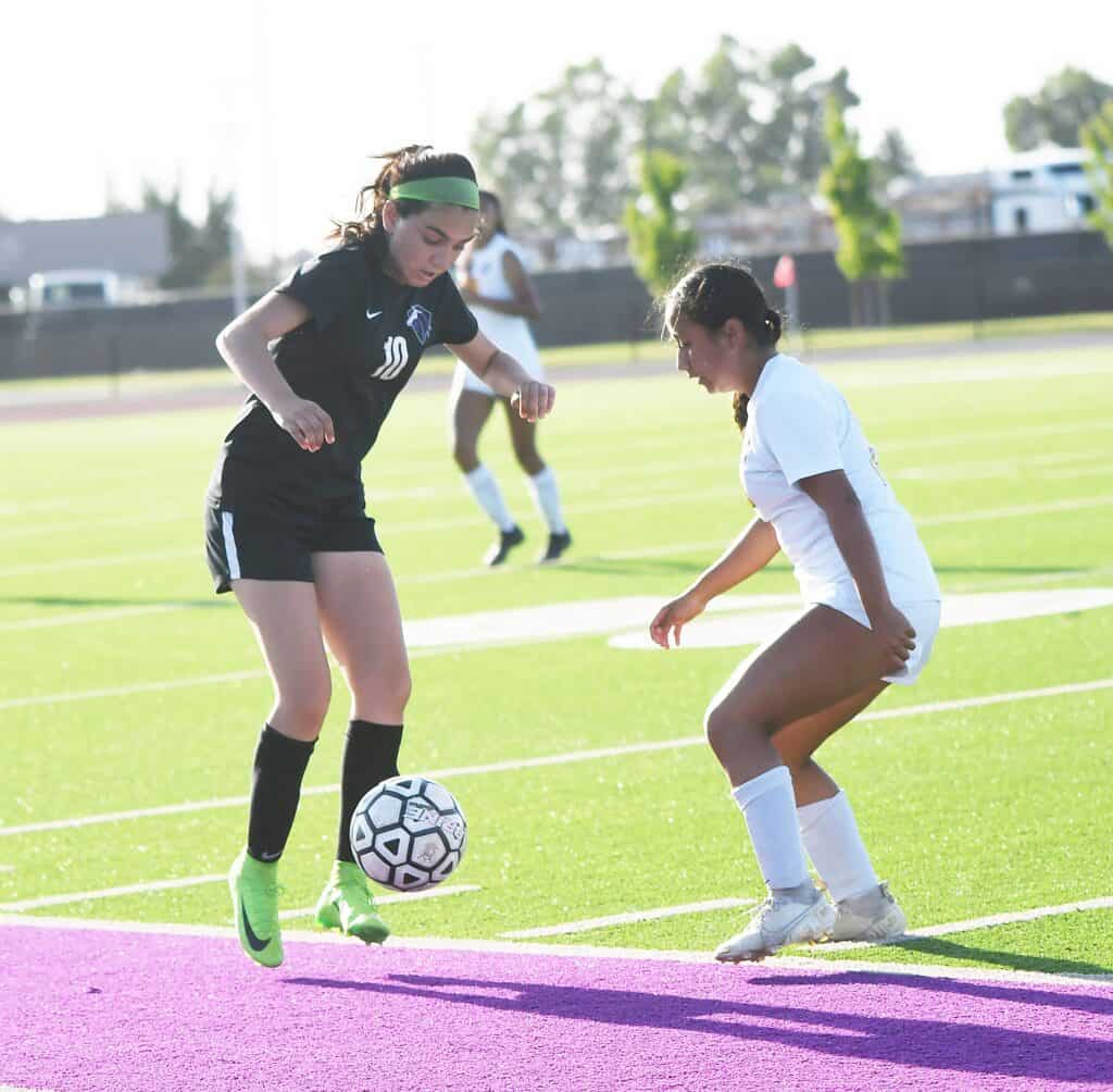 Photo - Madera South’s Jimena Gutierrez controls the ball from an Edison defender during Thursday’s loss. Gutierrez scored the Stallions’ lone goal.