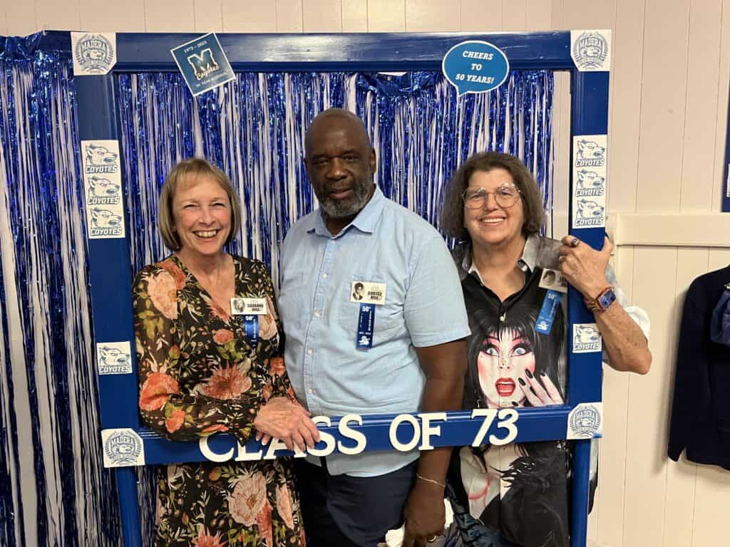 Photo - The three “Hill” kids from the Madera High School Class of 1973, Suzanne, Cortez and Tami Jo Hill, share laughs and a photo frame at their recent 50-year class reunion.