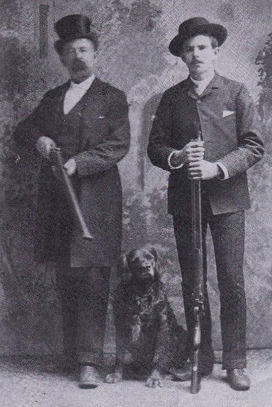 Photo - Ben Ducker, left, poses with his son William in 1900, as he holds the shotgun that he used against the U.S, Cavalry in 1902.