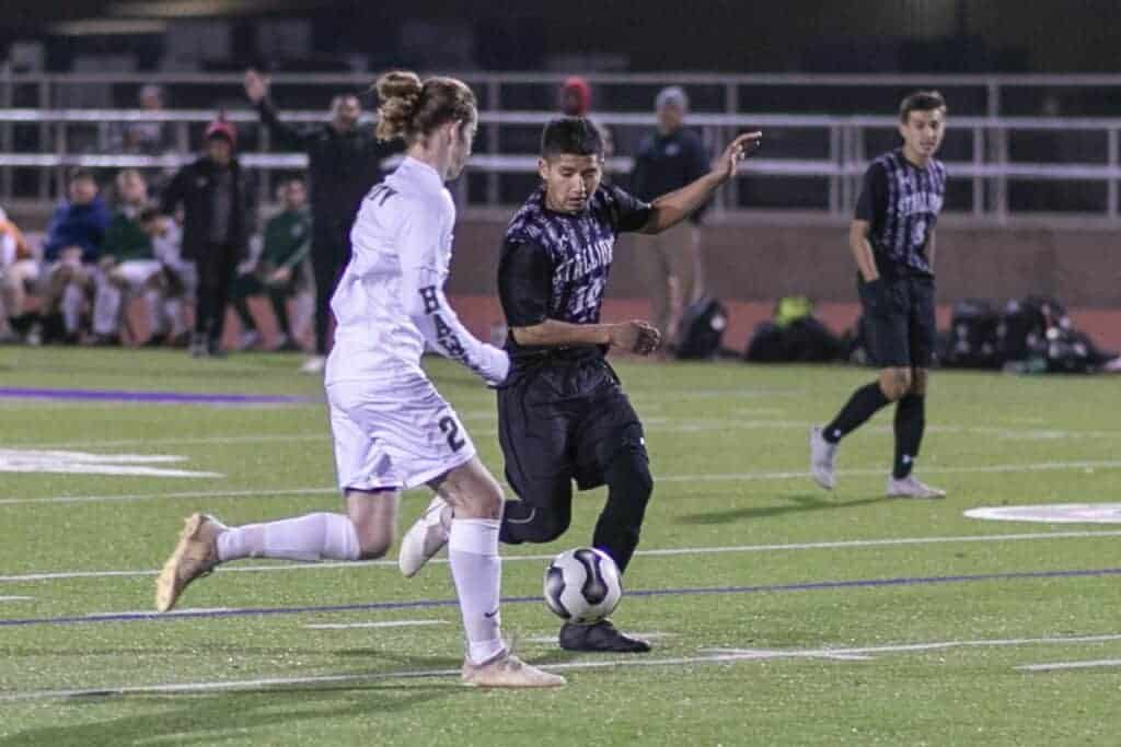 Madera South’s David Vasquez tries to dribble around Liberty’s Landon Howe during Friday’s non-league victory over the Hawks. Photo - Courtesy of Christoper Cross