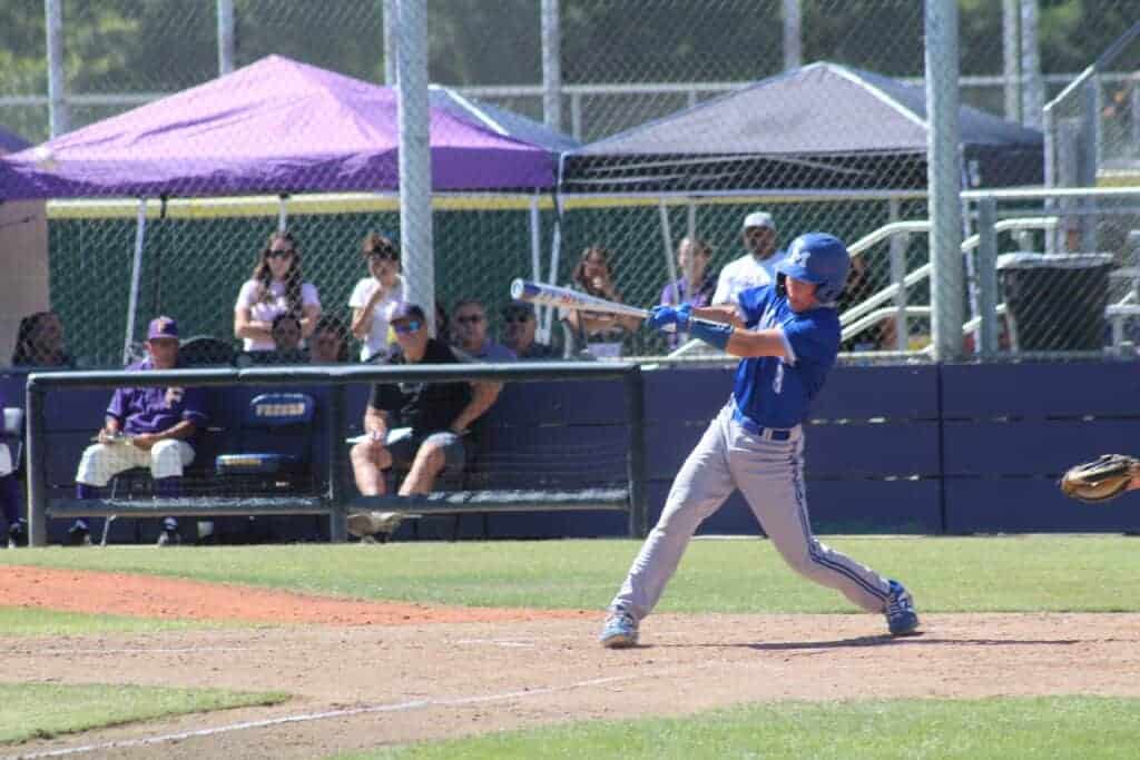 Photo - Madera’s Isaac Flores swings at a pitch for a seventh inning double that drove in two runs in Friday’s 11-2 victory over Fresno. Flores had three hits, drove in three runs and scored two runs in the win.