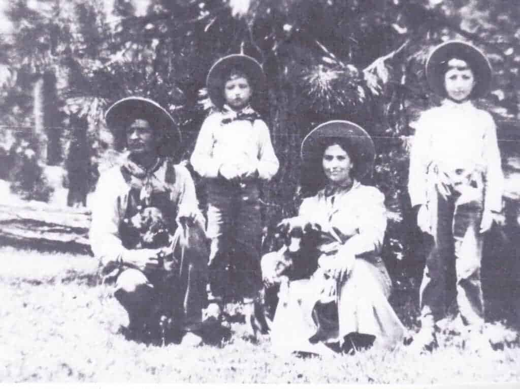 Photo - Olive Hensley is shown here with her sons Leonard and Earl and her husband; we are just not sure which husband, Charles Hensley or Walter Hensley?