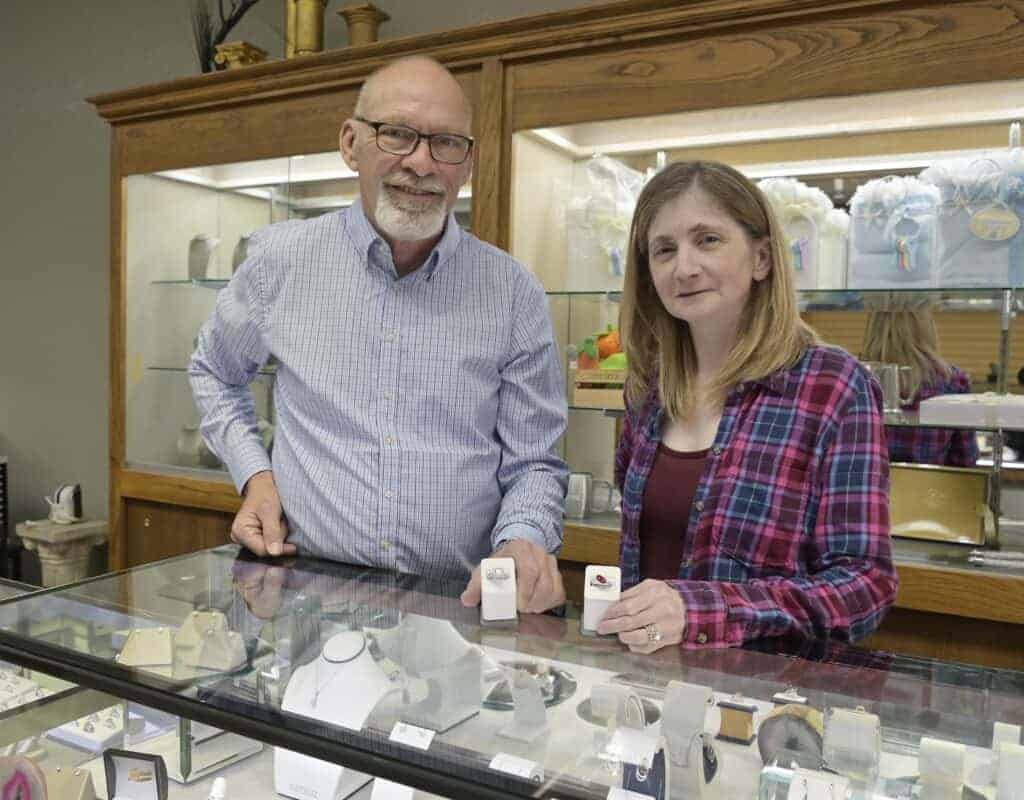 Photo - Virgil Anderson and Suzie Gran, owners of Leighton’s Custom Jewelry & Repair, display a couple of rings.
