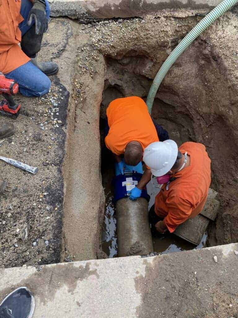 Photo - City of Madera Public Works Department employees work to repair a water main leak on Olive Avenue earlier this week.