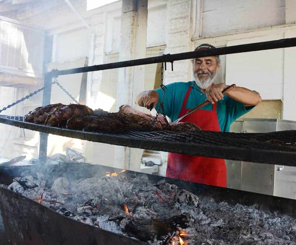 Photo - Hector Romo barbecues tri-tips at Petrucci’s.