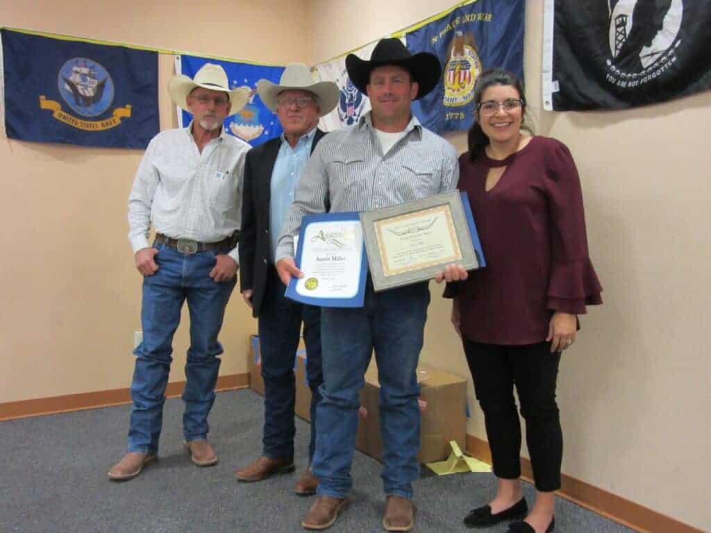 Photo - From left, MCCA President David Gill and member Rick Drayer present Austin Miller with the association’s Cowboy of the Year award as Mika Flores looks on.