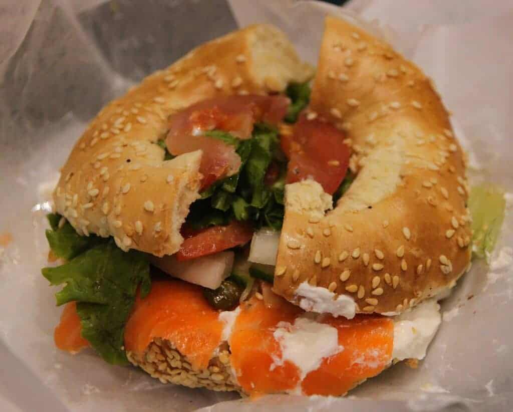 Photo - Cream cheese and lox on a seeded bagel is a treat. Add a thin slice of red onion and perhaps some capers for added flavor.