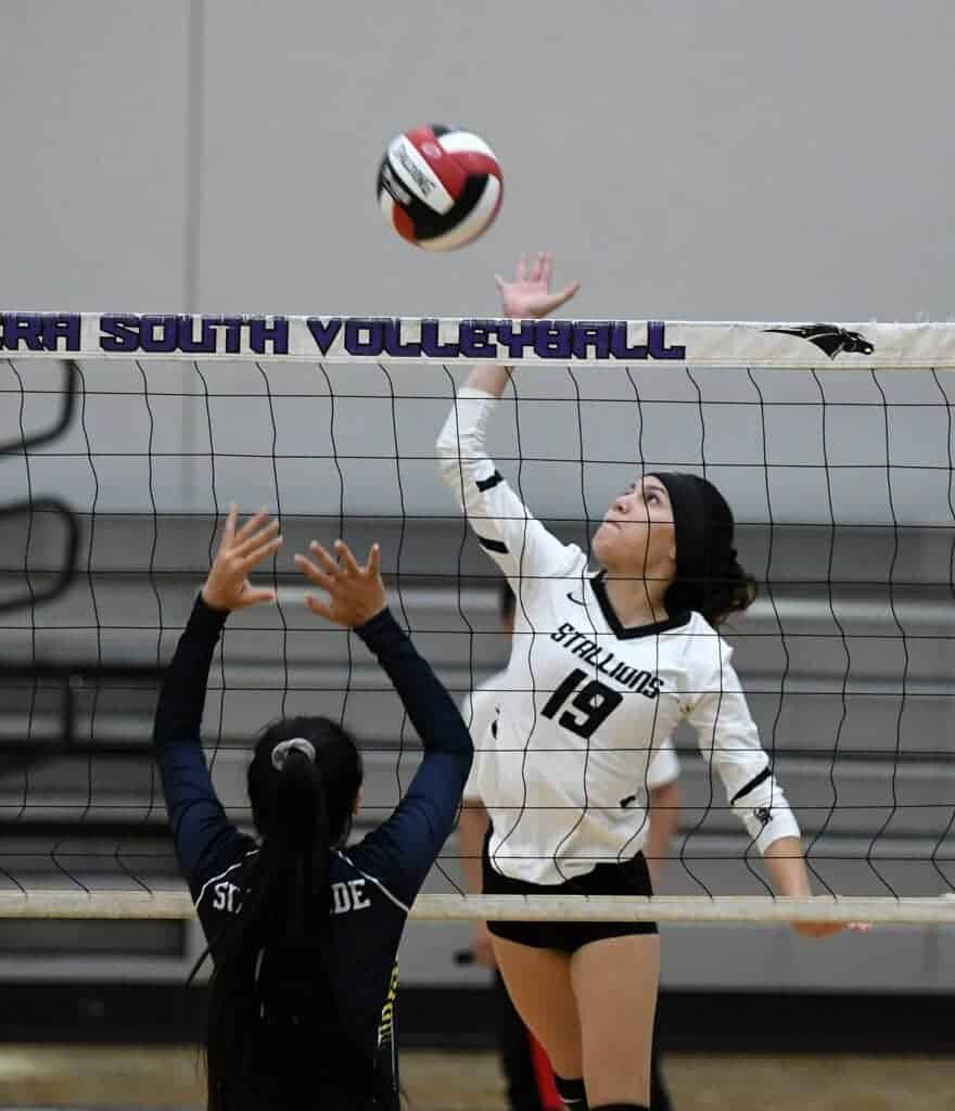 Photo - Madera South’s Kiara Alvarado jumps up to put down a kill during a three-set sweep over the Sunnyside Wildcats in Tuesday’s home opener.