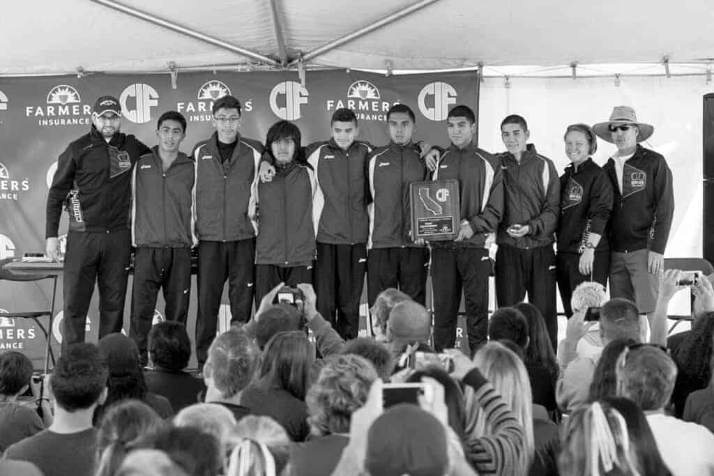 Photo - The Madera South Stallions boys cross country team stands to receive their third place team trophy at the 2014 CIF State Cross Country Championships.
