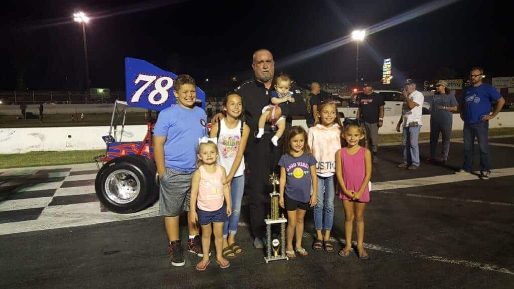 Photo - Donnie Large, shown with his grandchildren at the Madera Speedway, was on lap 21 and leading a supermodified race when his car bounced off the second turn wall and got hit by another car. Large died at the hospital, his family said.