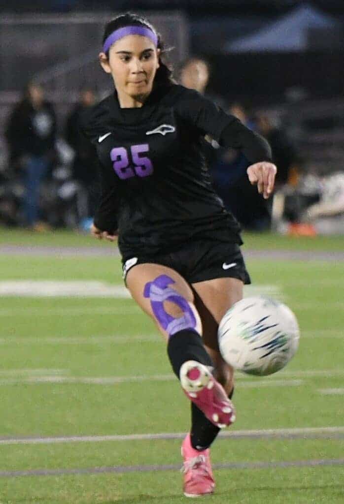 Photo - Madera South’s Alysa Guillen sends a shot on goal for the first of her two goals in Friday’s 4-0 victory over the Hoover Patriots. Guillen scored a goal in the first and second half. 