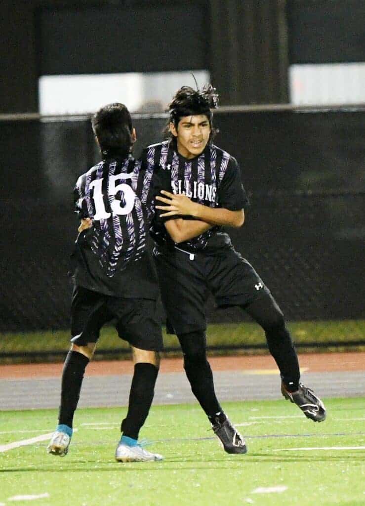 Photo - Madera South’s Luis Diaz (15) celebrates with Raul Arzola after Arzola scored the Stallions’ second goal of a 4-3 victory Friday.