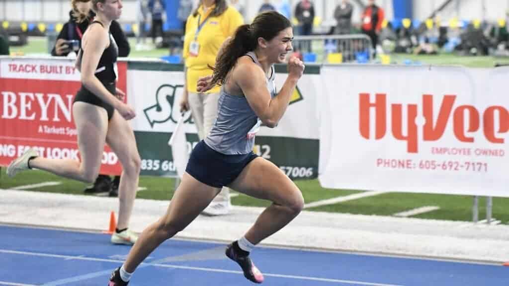 Photo - Former Madera Coyote Penelope Leach competes in the pentathlon for Vanguard at the Women’s Indoor Nationals last week. The senior set the school record she previously held, and placed 10th in the nation, just out of her goal of eighth place. 