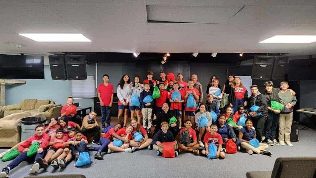 Photo - Students of the Crossroads Christian’s fifth grade class gathers after putting together almost 200 blessing bags to homeless in the Madera and Fresno area.