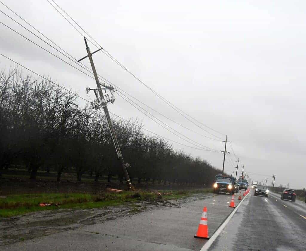 Photo - PG&E crews are on scene to repair a damaged power pole on Avenue 12 on Thursday.