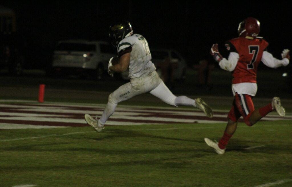 Photo - Liberty’s Kaleb Roth lunges into the end zone for one of his two touchdowns in Friday’s 56-26 loss to the Kerman Lions.