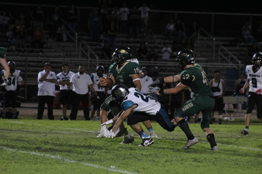Photo - Liberty’s Noah Bonilla returns a fourth quarter interception that led to the go-ahead touchdown in Friday’s 24-17 victory over Mendota. Bonilla also threw for 155 yards and a touchdown.