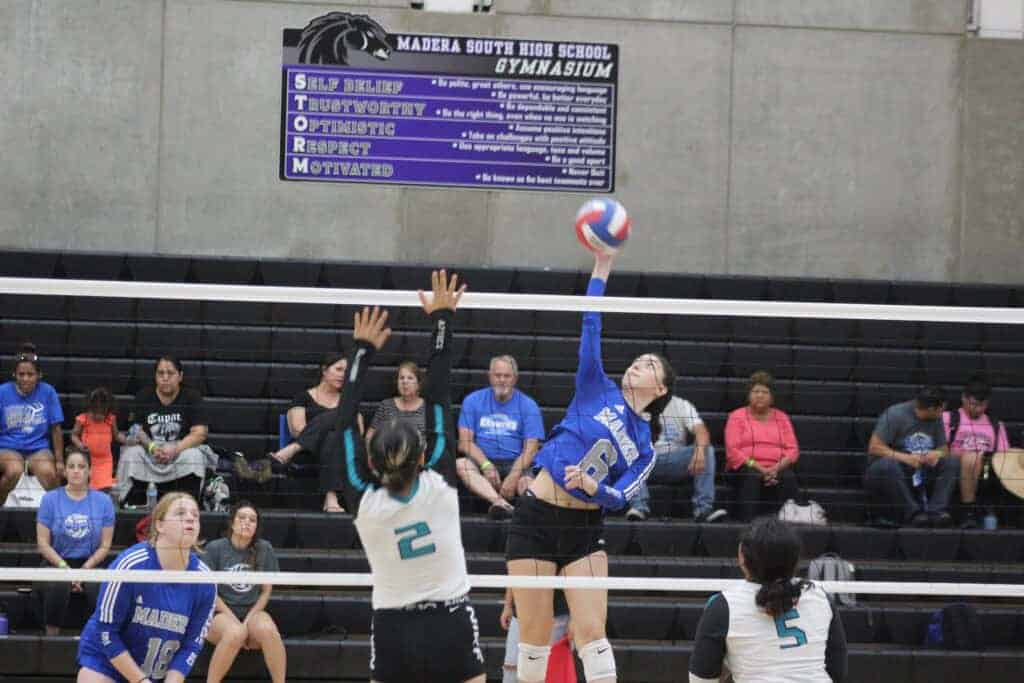 Photo - Madera’s Aliyah Garcia reaches up for one of her 12 kills in a two-set win over Mendota in the Silver Division quarterfinals at Saturday’s Madera Classic.