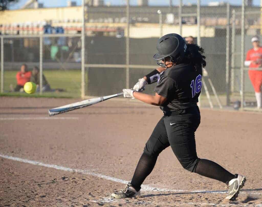 Photo - Madera South’s Elena Garcia swings at a pitch during Friday’s victory over Sanger. Garcia scored Madera South’s tying run in the fifth inning.