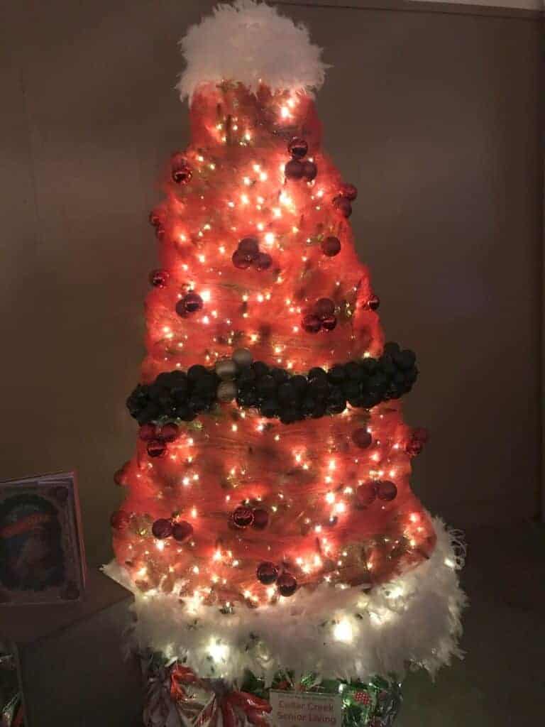 Photo - Cedar Creek Senior Living will auction a tree at the 2024 Trees for Charity dinner on December 7, raising funds for Community Action Partnership of Madera County. Their 2023 tree looked like a big Santa hat.