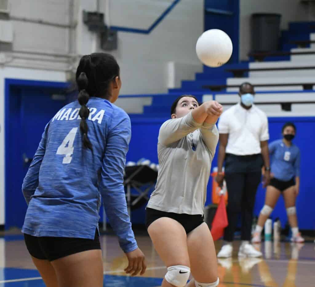 Photo - Madera libero Sofia Mata records a dig to start the Coyotes’ offense in Thursday’s loss to Yosemite.