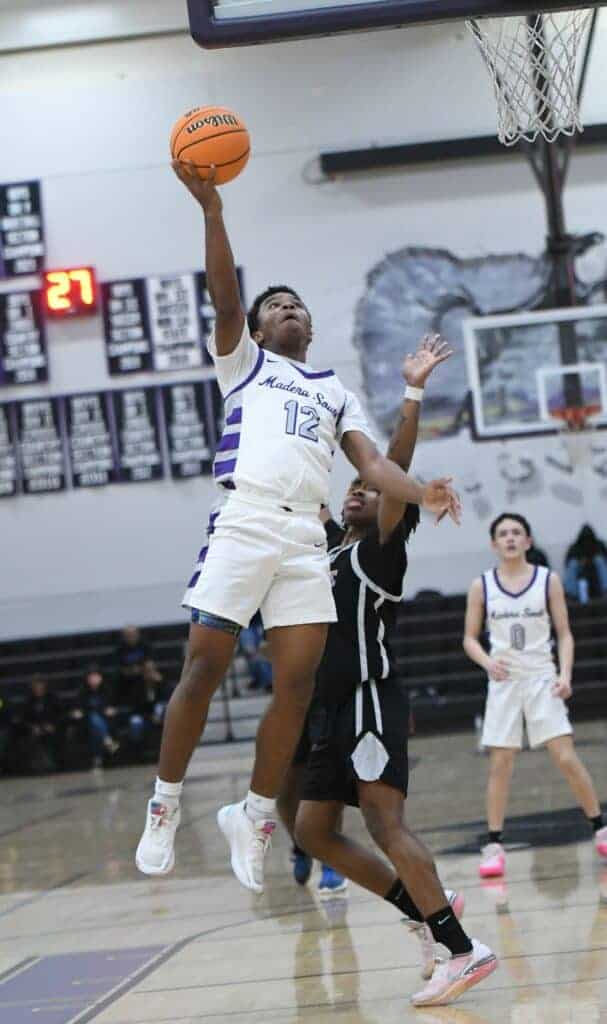 Photo - Madera South’s Hasani Heard drives in for a bucket in the first quarter of a loss to the McLane Highlanders. Heard scored six points in the game. 
