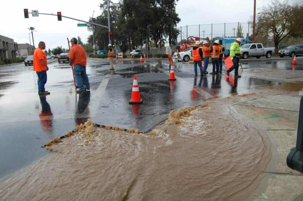 Utility and City of Madera work crews coordinate the repair of a broken water line Nov. 27 on the westbound side of Howard Road, just west of Schnoor Avenue. The line was reportedly struck by utility crews working in a trench at the location. The water line was repaired the same day according to city officials, but traffic was detoured around the intersection.