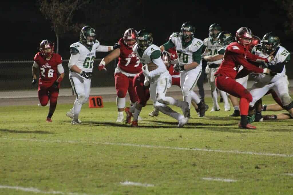 Photo - Liberty’s Quentin Stewart breaks out of a tackle during Friday’s victory over Chowchilla. Stewart rushed for more than 100 yards and scored two touchdowns.