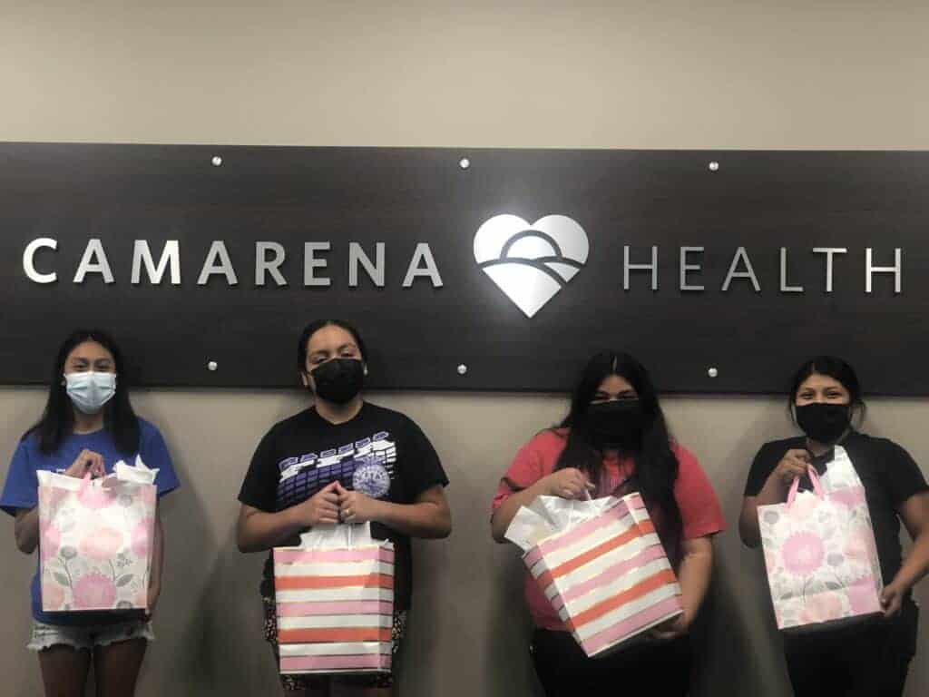 Photo - Madera Unified Certified Nursing Assistant Students from Camarena Health Center show off gift bags they received after completing the California Area Health Education Center scholars program. From left are Jenny Alvarez, Perla Reyes, Ruby Tiscareno and Azucena Eugenio.