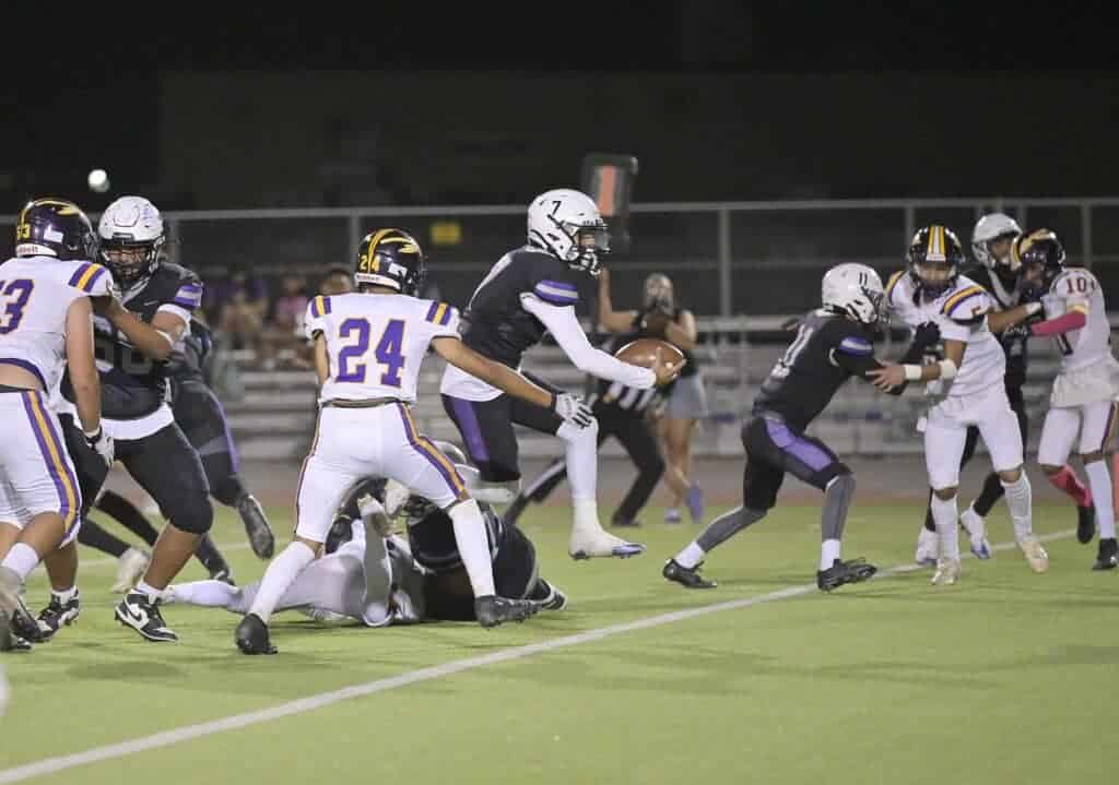 Photo - Madera South quarterback Ahmad Sharhan scores one of his three touchdowns during Friday’s victory over the Fresno Warriors. Sharhan accounted for all six touchdowns in the 42-7 victory on Homecoming.