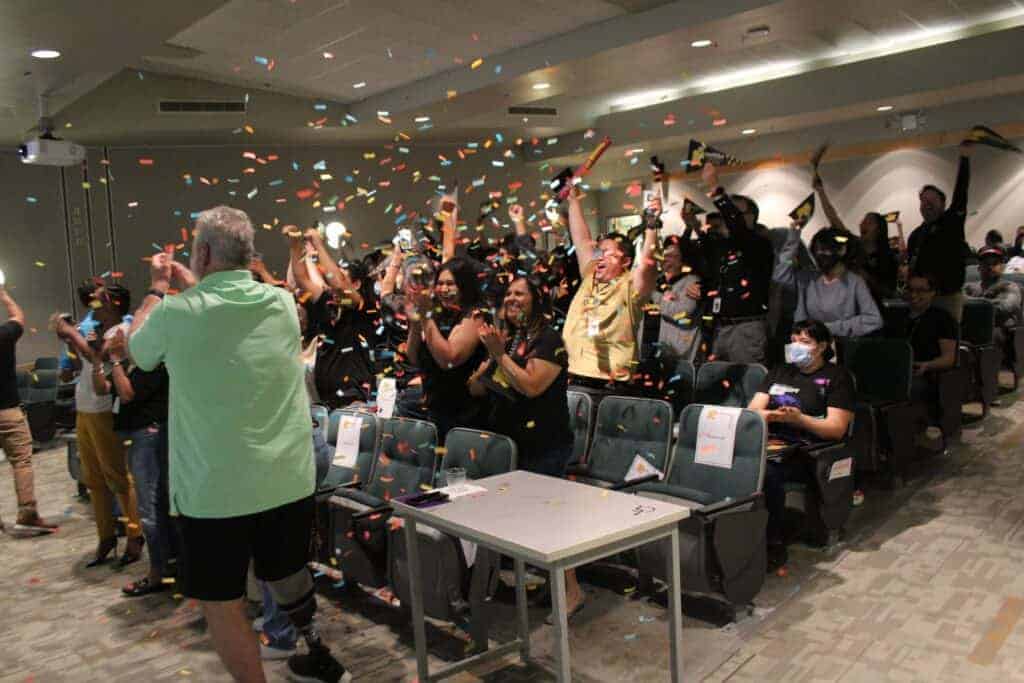 Photo - Madera Community College staff and students erupt in celebration after they learned thy were the winner of the Lumina Foundation’s Million Dollar Community Challenge, which was announced Wednesday.