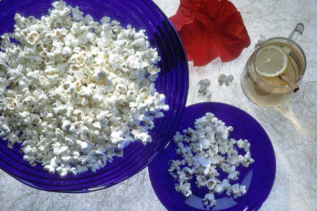 Photo - Most popcorn treats start with plain, unbuttered, unsalted popcorn. You can turn this into delicious, colorful popcorn balls for Halloween or anytime.