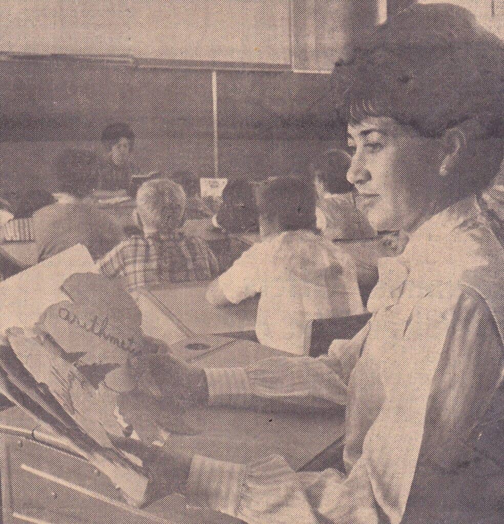 Photo - Mrs. Raul Salazar squeezed behind a child’s desk 50 years ago and listened in on Mrs. LoRaye Gould’s class at John Adams School. Madera Unified was holding open house in most of its schools at the time.