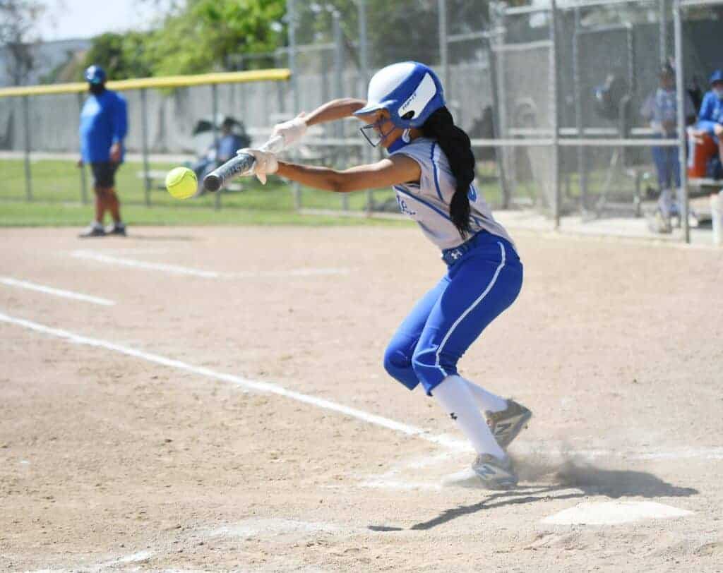 Photo - Madera’s Lealani Ricks tries to put down a bunt during Wednesday’s loss to Clovis East. The lead-off hitter leads the team in batting average and hits this season.