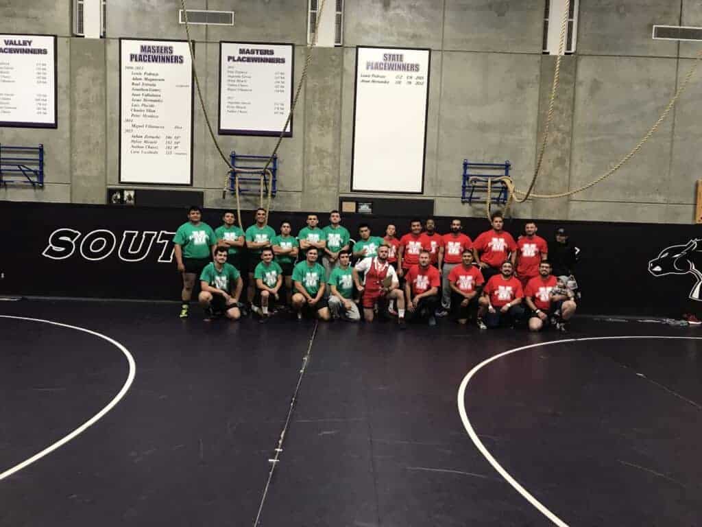 Photo - Madera South coaches and alumni met for a dual meet Jan. 23 as a fundraiser to donate more than 50 toys to Victim Services of Madera County.