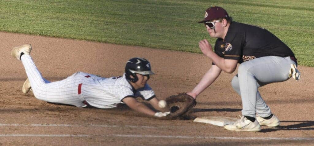Photo - Matilda Torres’ Amani Sua slides in past the pick-off attempt during Tuesday’s 3-1 loss to Sierra. However, Sua later stole second and third to score the Toros’ lone run. 