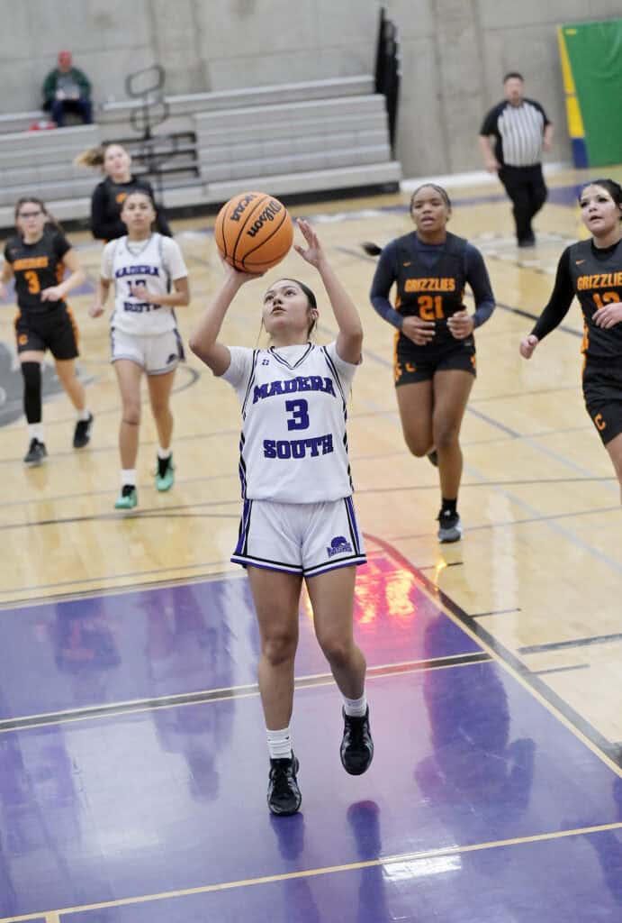 Photo of Madera South’s Giselle Mendoza drives in for a layup after a steal during Friday’s victory over the Central Grizzlies. Mendoza was one of 10 Stallions to score in the 41-17 win.