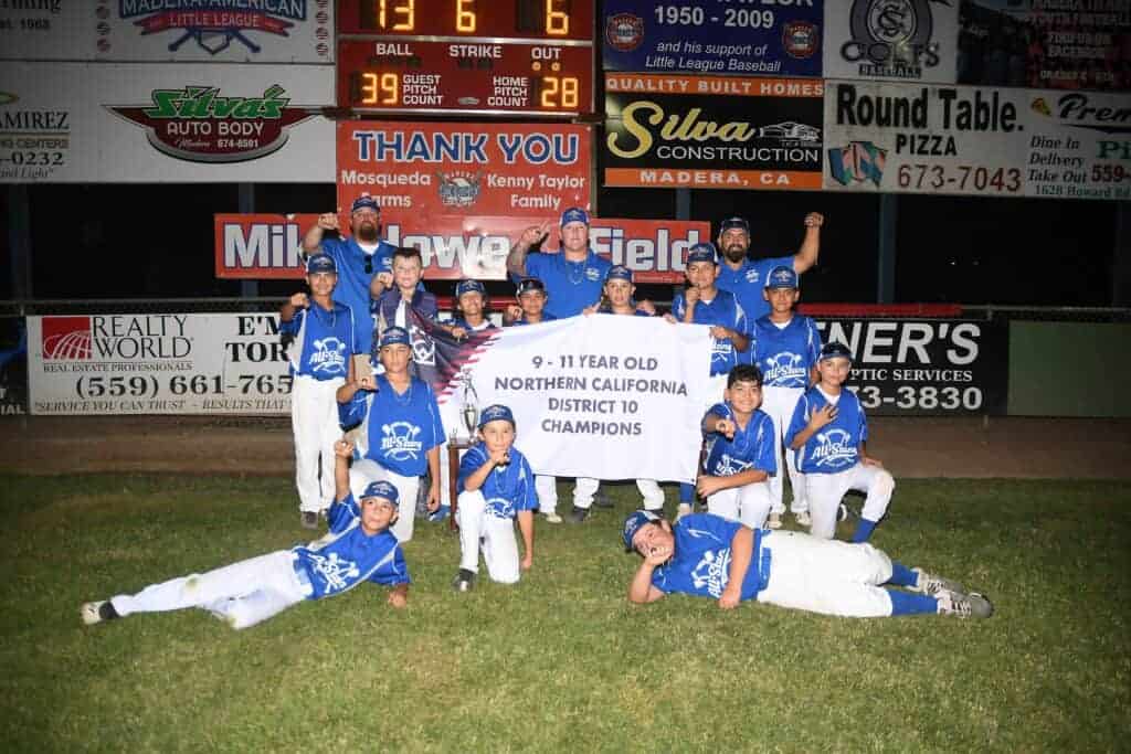 Photo - Members of the Madera American Little League 9-11-year-old All-Start team show off the rings they received after defeating River Park to win the District 10 championship Friday.
